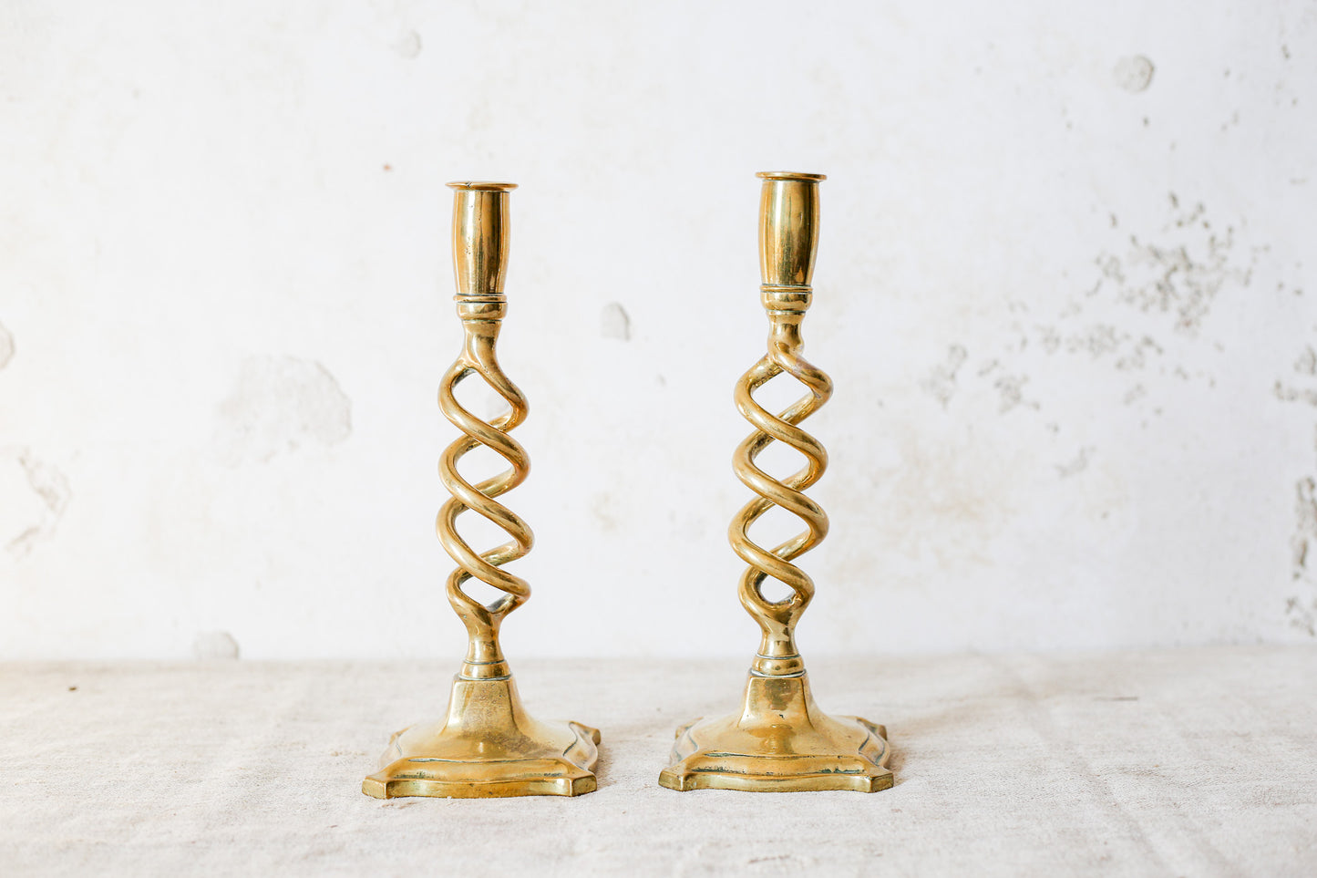 Pair of 19th Century English Cast Brass Open Barley Twist Candlestick Holders with Flared Square Bases