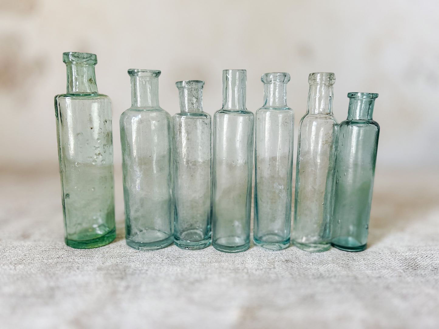 Set of 7 Antique English Aqua Glass Cylinder Bottles