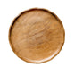 Wooden plate on a textured white surface