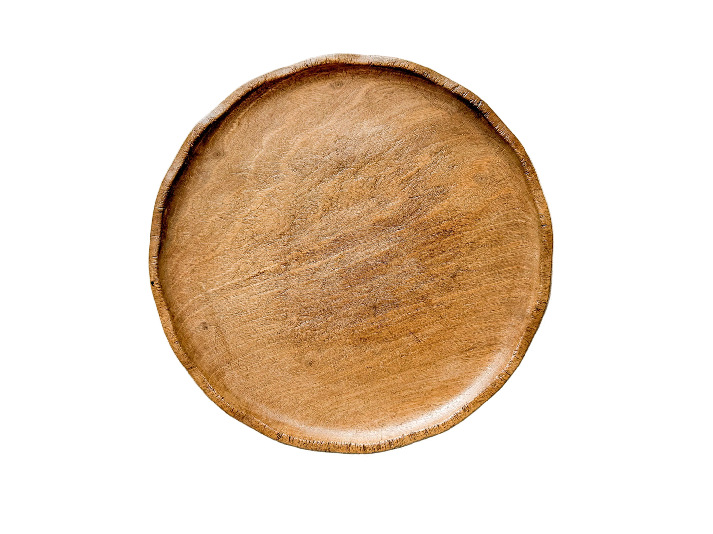 Wooden plate on a textured white surface