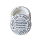 Vintage shaving cream container with a label on a wooden surface