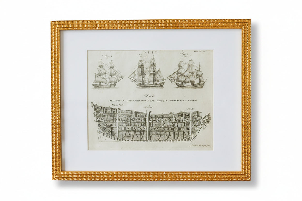 Framed print of a ship diagram on a textured wall.