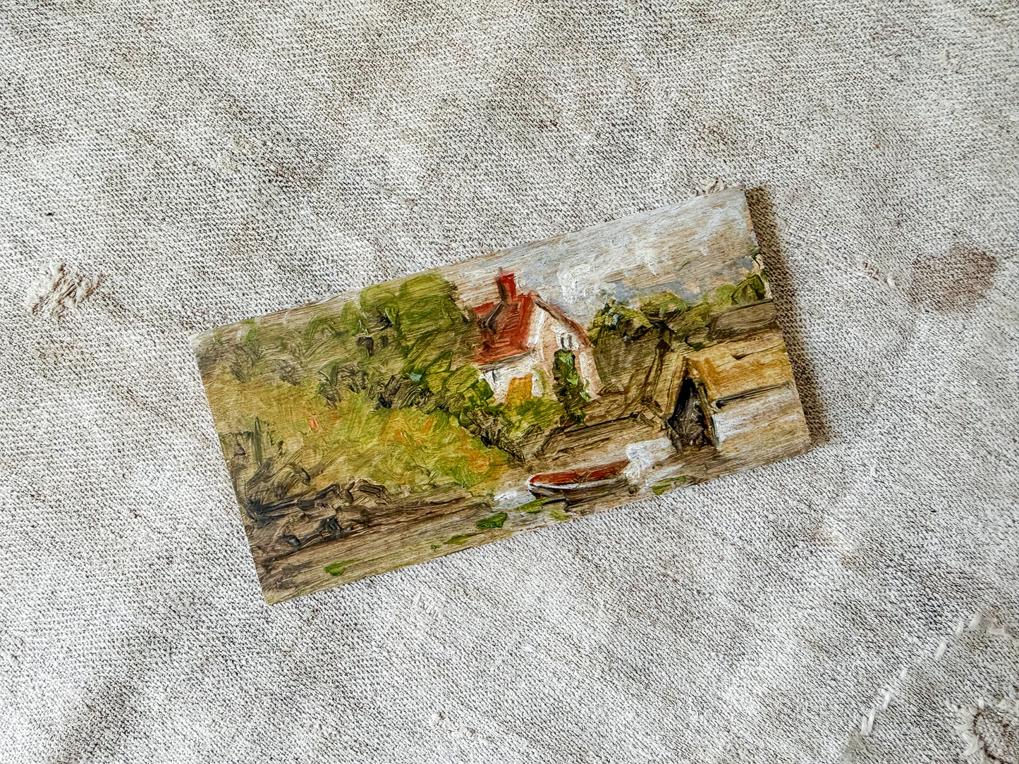 Miniature Painting on Pine of Docked Boat Near Cottage