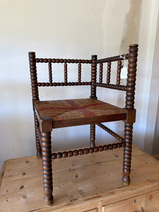 Corner bobbin chair with patterned woven rush seat