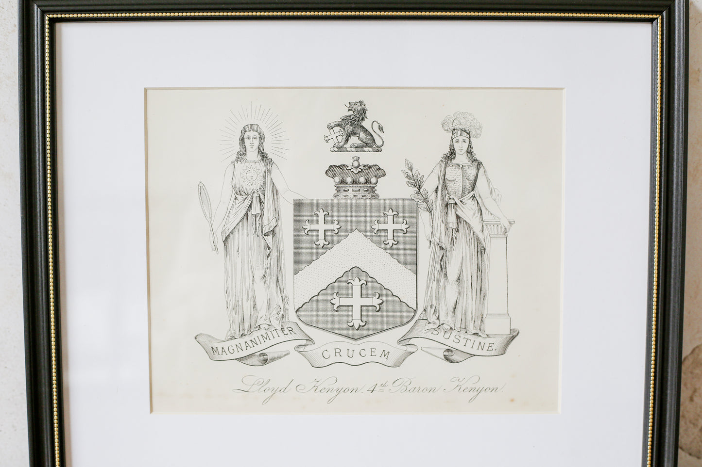 Framed artwork with a crest and two figures on a white background