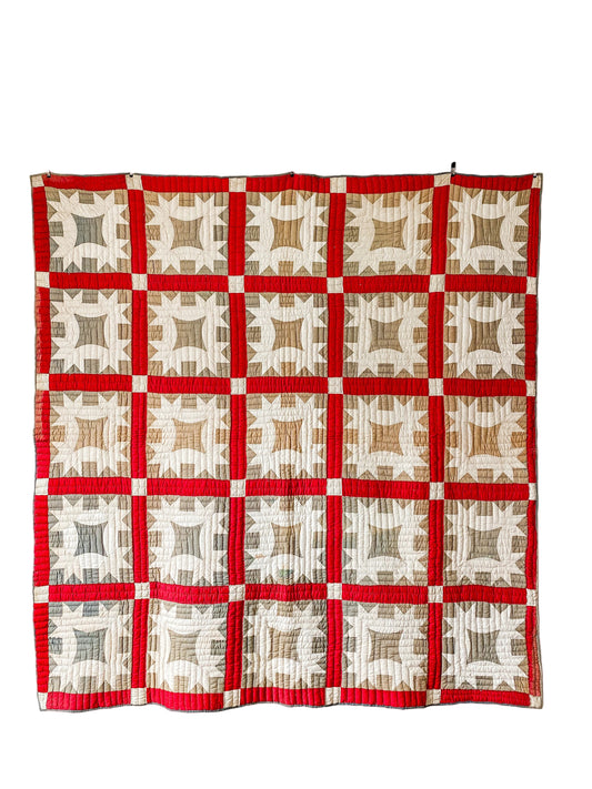 Quilt with red and beige pattern on a white background