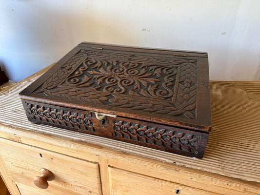 Ornately carved desktop box with '1892' and JM initials on back