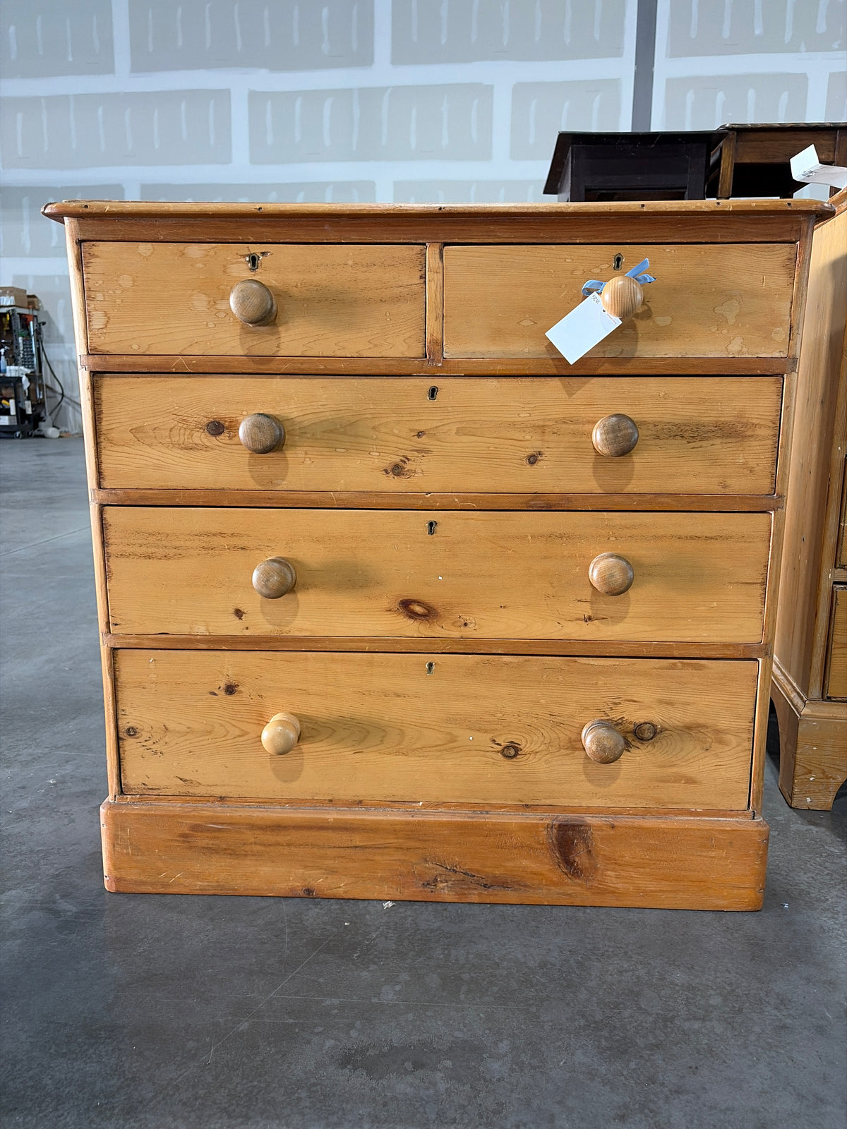 2 over 3 pine chest of drawers on plinth base