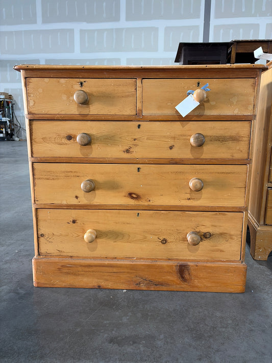 2 over 3 pine chest of drawers on plinth base