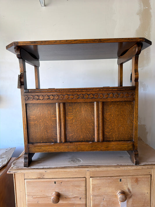 Oak convertible side table/bench with interior storage, c1920