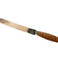 Bread knife with wooden handle on a textured fabric background