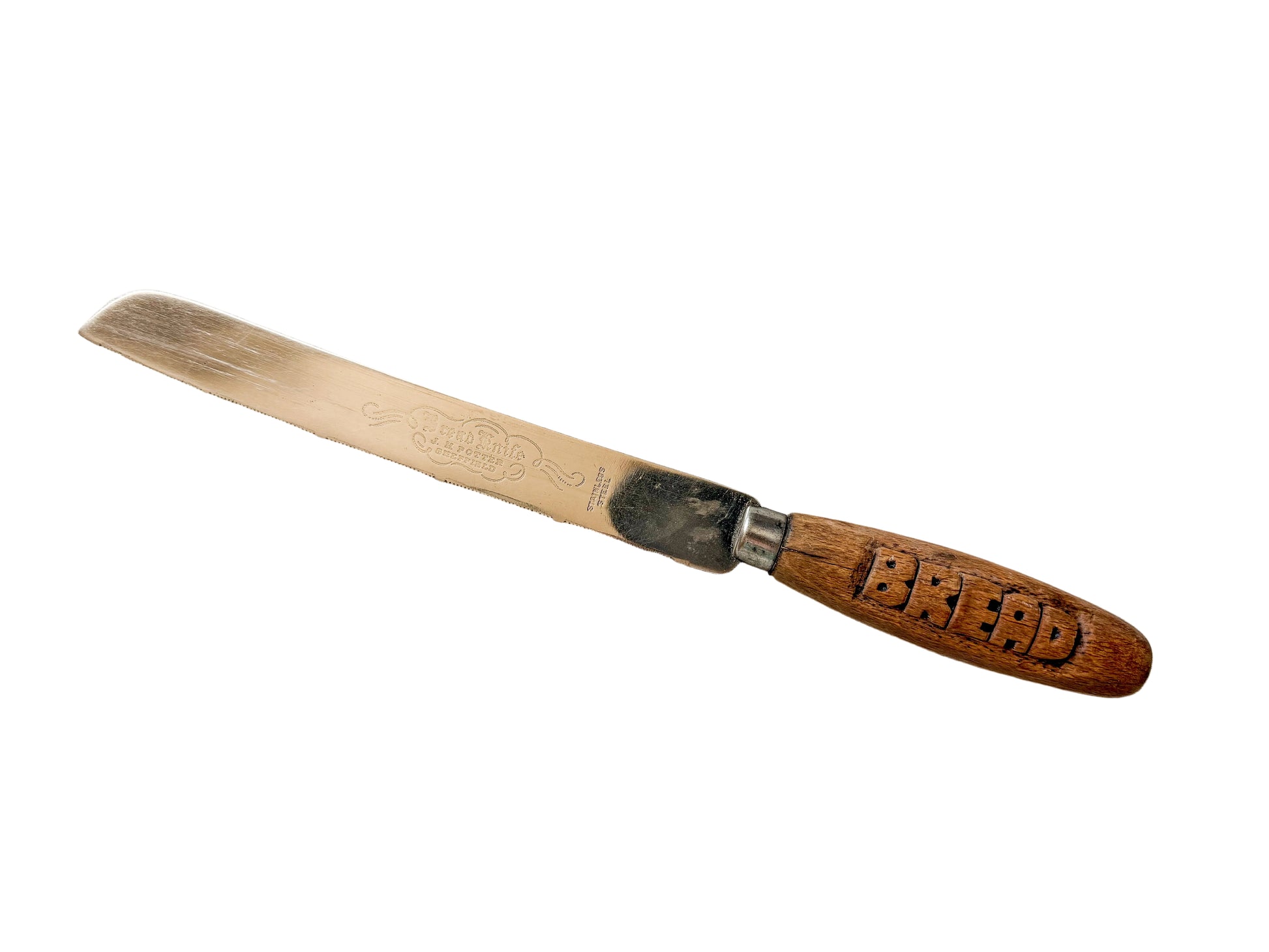 Bread knife with wooden handle on a textured fabric background