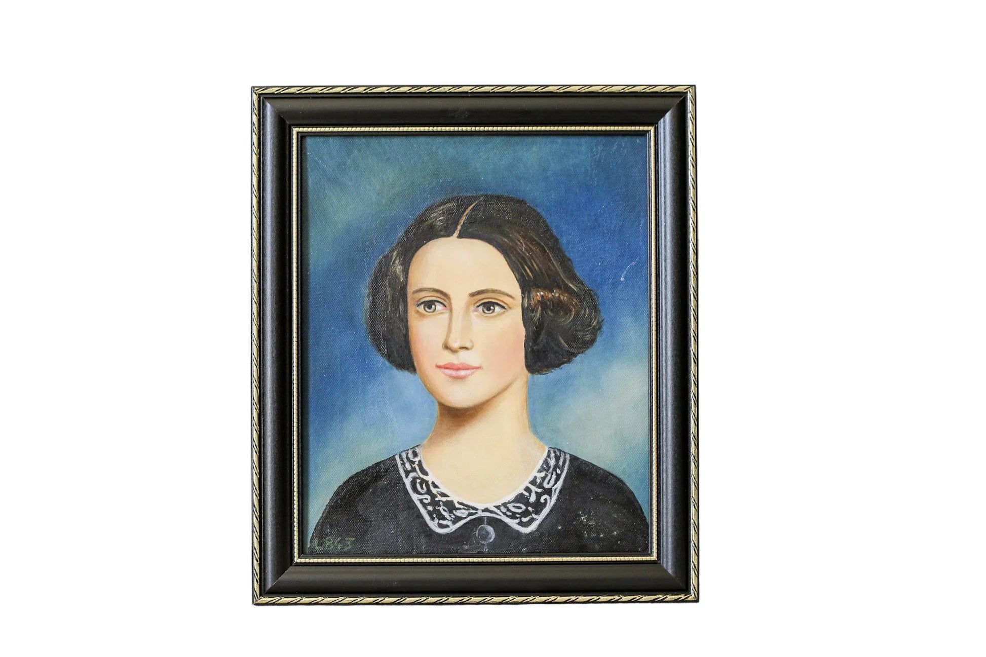Framed portrait of a woman with dark hair and a white collar on a textured wall.