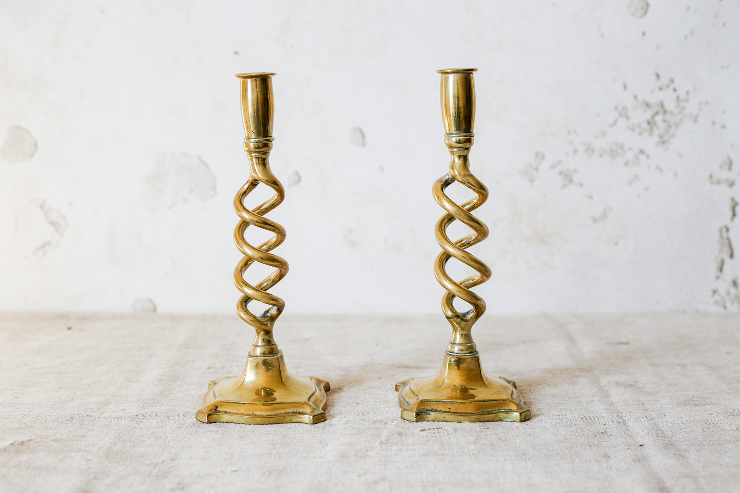Pair of 19th Century English Cast Brass Open Barley Twist Candlestick Holders with Flared Square Bases
