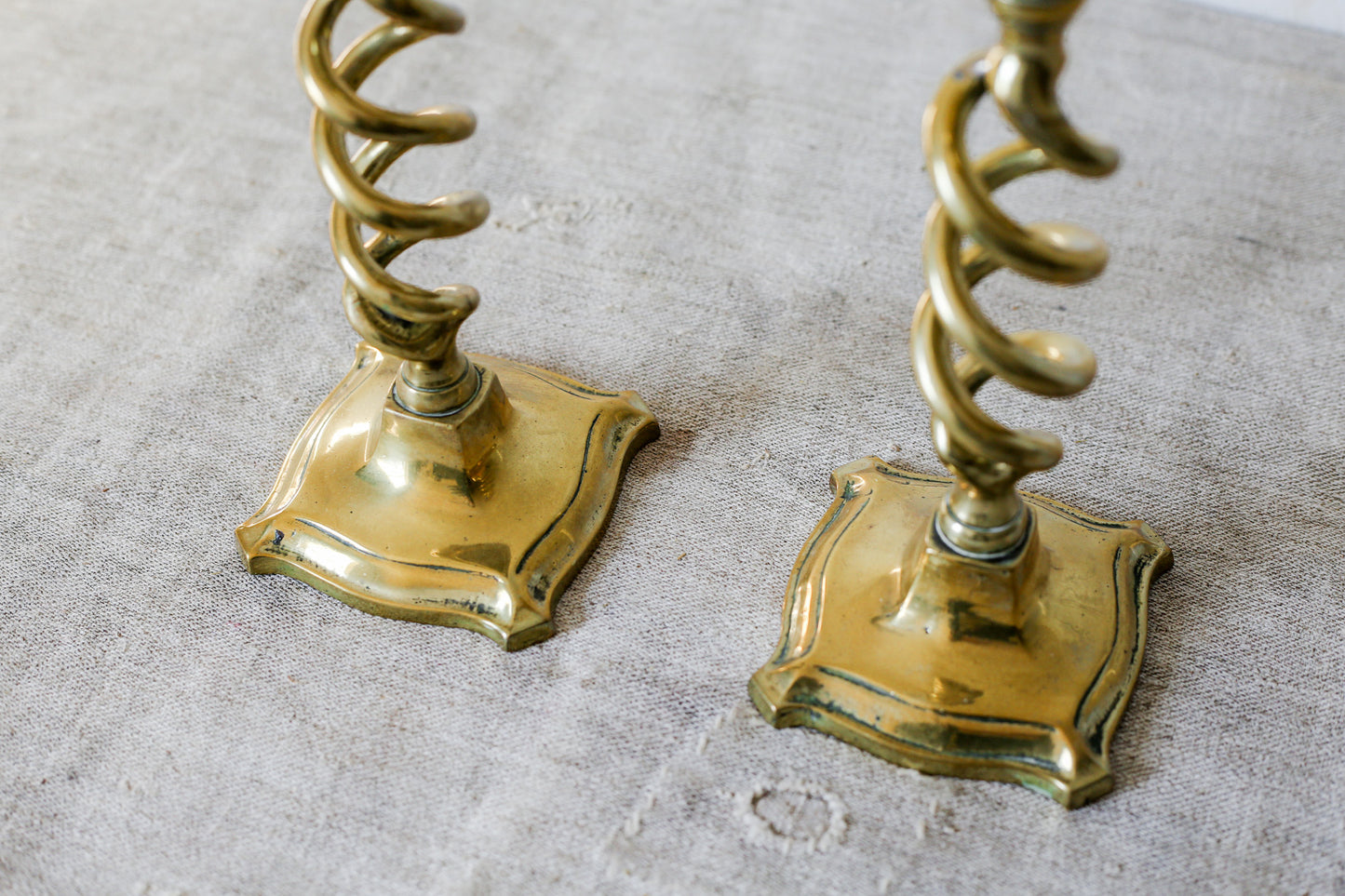 Pair of 19th Century English Cast Brass Open Barley Twist Candlestick Holders with Flared Square Bases