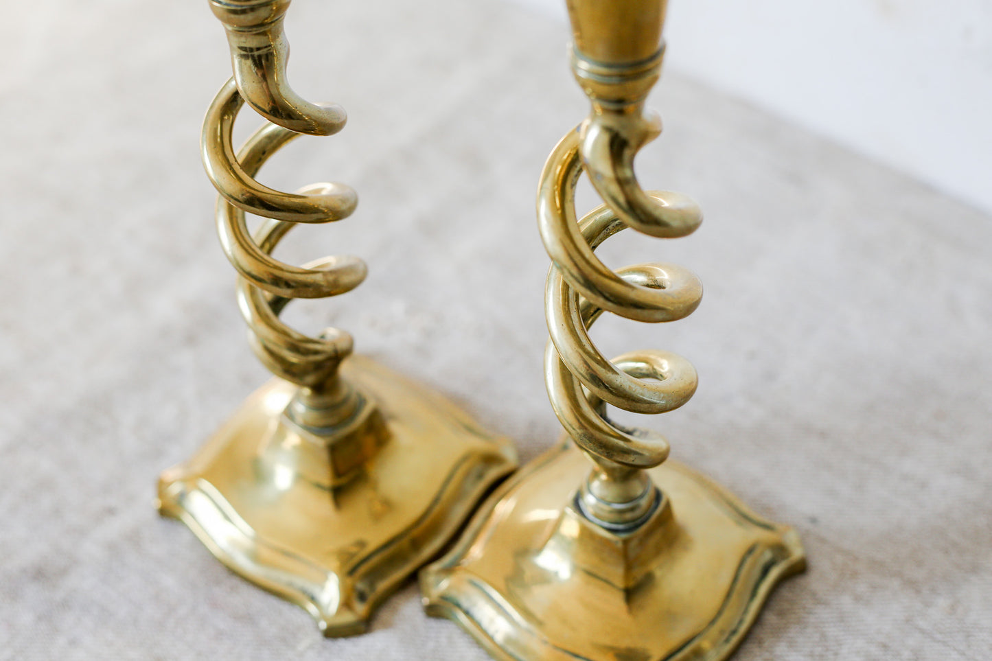 Pair of 19th Century English Cast Brass Open Barley Twist Candlestick Holders with Flared Square Bases