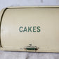 Yellow Metal Roll-Top Cake Countertop Storage Tin, c1940