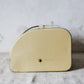 Yellow Metal Roll-Top Cake Countertop Storage Tin, c1940
