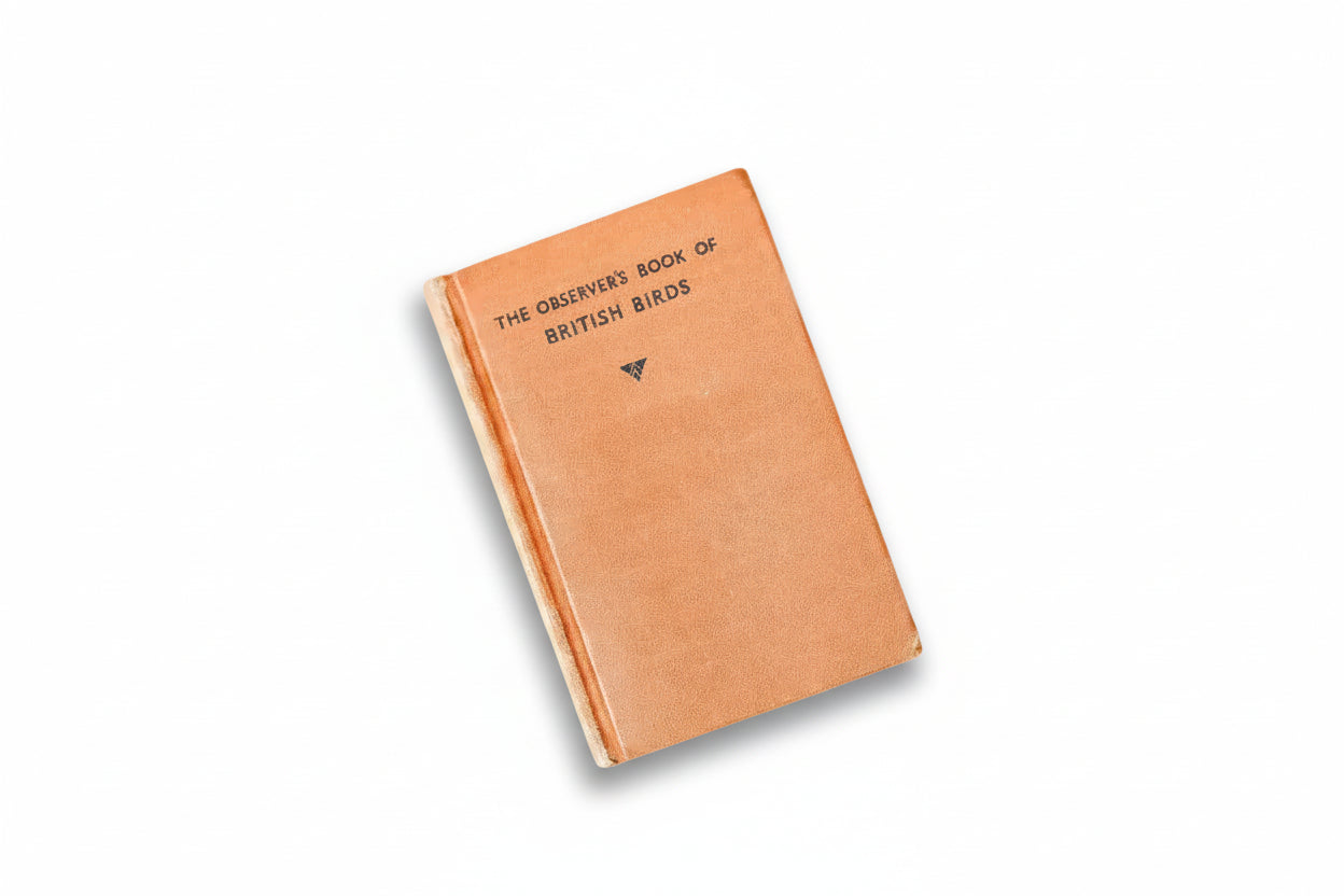Vintage book titled 'The Observer's Book of British Birds' on a textured surface