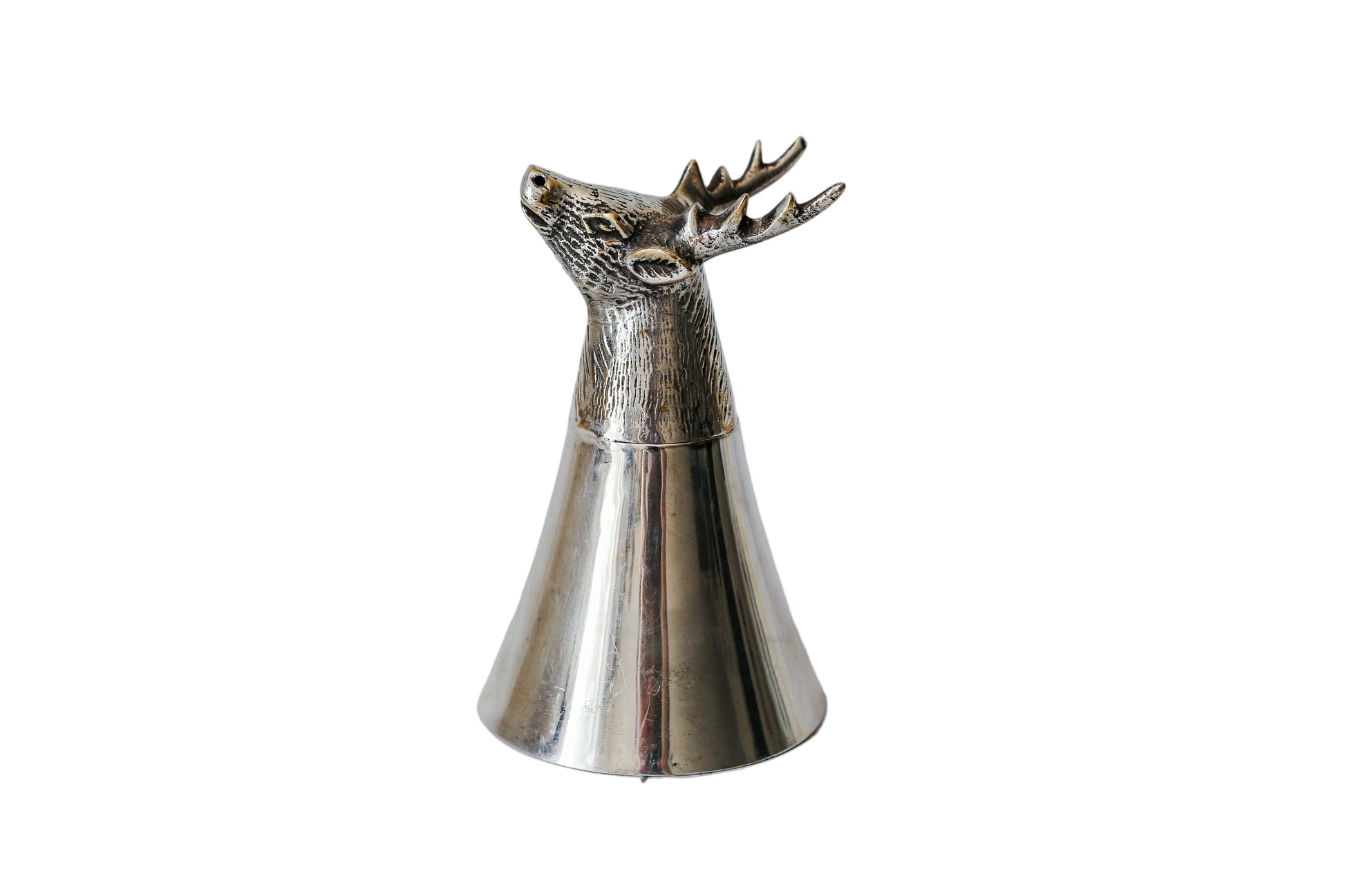 A polished silver-toned metal deer head stopper with antlers on a conical base, standing on a white marble surface.