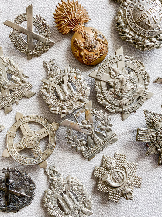 Collection of military badges on a textured surface