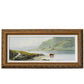 A framed landscape painting of a coastal scene with green hills, water, and a cow on the beach, set in an ornate gold frame against a textured white wall.