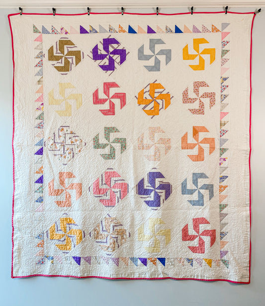 Vintage Whirligig Quilt with Sawtooth Border