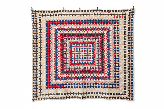Quilt with geometric pattern on a white background
