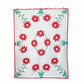 Floral quilt with red flowers and green leaves on a white background